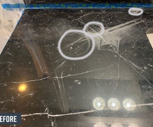 Black marble vanity top before restoration