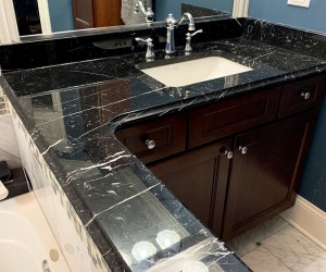Black marble vanity top after restoration